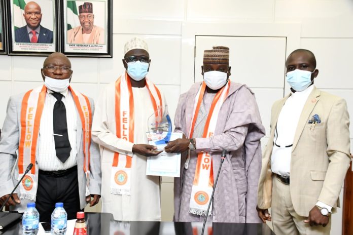 L-R The Director Central Workshop & Equipment FMWH, Engr. Chris Onyibo, The Permanent Secretary FMWH, Babangida Hussaini, Chairman Council of Fellows OSHA, Nigeria, Dr. Dalhatu M.Ahmed and the Regional Administrator, Engr. Emmanuel Uwalaka during the Investiture of the Fellowship Conferment. L-R The Director Central Workshop & Equipment FMWH, Engr. Chris Onyibo, The Permanent Secretary FMWH, Babangida Hussaini, Chairman Council of Fellows OSHA, Nigeria, Dr. Dalhatu M.Ahmed and the Regional Administrator, Engr. Emmanuel Uwalaka during the Investiture of the Fellowship Conferment.