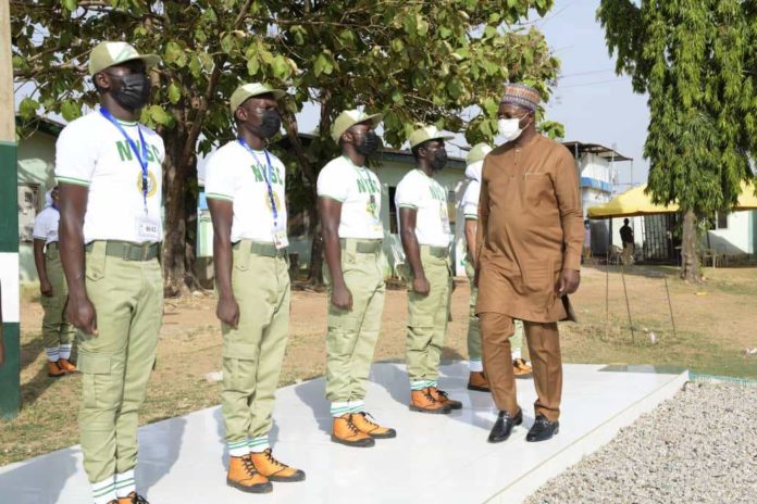 Hon. Minister of Youth and Sports Development, Mr. Sunday Dare inspecting Corp Members during his working visit to the NYSC Orientation Camp, Kubwa Abuja