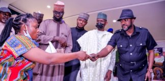 (2nd Right) the Representative of the Honourable Minister of Humanitarian Affairs, Disaster Management and Social Development, the Permanent Secretary of the Ministry, Bashir Nura Alkali, (1st Right) the Representative of Kogi State Governor, Deputy Governor of the State, Edward David Onoja, (4th Right) Director Humanitarian Affairs, Grema Ali Alhaji, (3rd Right) Focal Person, National Social Investment Programme (NSIP), Kogi State, Abdulkareem Suleiman Onyekehi, (1st Left) a Beneficiary, Christopher Queen, during the Flagg-Off of the Federal Government Cash Grant for Rural Women in Kogi State, held at Kogi State Government House. On 2nd March, 2021. Photo: Khalid Ahmed.