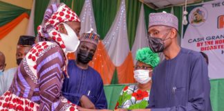 (1st Right) The Representative of the Honourable Minister of Humanitarian Affairs, Disaster Management and Social Development, The Permanent Secretary of the Ministry, Bashir Nura Alkali,(2nd Right) the Representative of the Deputy Governor of Akwa-Ibom State, the Deputy Speaker and Chairman Social Welfare, Rt. Hon. Felicia Bassey, (3rd Right) Director Humanitarian Affairs of the Ministry, Grema Ali Alhaji, (1st Left) a beneficiary of the Grant, Inyene Daramfom, during the Flag-off of the Federal Government Cash Grant for Rural Women in Akwa-Ibom State, held at Women Developement Centre, IBB Avenue, Uyo. On 4th March, 2021. Photo: Khalid Ahmed