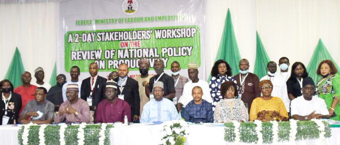 The Permanent Secretary Federal Ministry of Labour and Employment Dr. Yerima Peter Tarfa (4th left); the Deputy President, NLC Comrade Joe Ajaero (4th right); DG NPC, Dr Kashim Akor (2nd left); Director, Productivity Measurement and Labour Standards, Dan Neburagho (1st right); Director General, Micheal Imodu Institute of Labour Studies, S. I. Alabi (1st left) and other participants at the Stakeholders Workshop on the Review of National Policy on Productivity in Abuja.