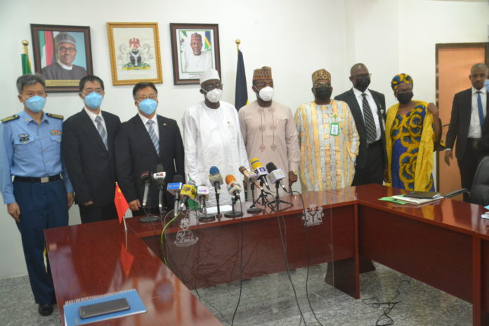 L-R: Military Attache, Lin Wei; Deputy Ambassador, Zhao Yong; Chinese Ambassador to Nigeria, His Excellency, Cui Jianchun; Minister of Police Affairs, Muhammad Maigari Dingyadi; Permanent Secretary, Tope Fashedemi; Director (Police Service Department), Mr. Umar Shehu Daura; Director (Legal|), Barr. Bolarinde Omoluabi; Director (Police Investigation Department), and Mrs. Mary Ele-Ojoh Akpa during a courtesy call to the Ministry’s Headquarters, Abuja
