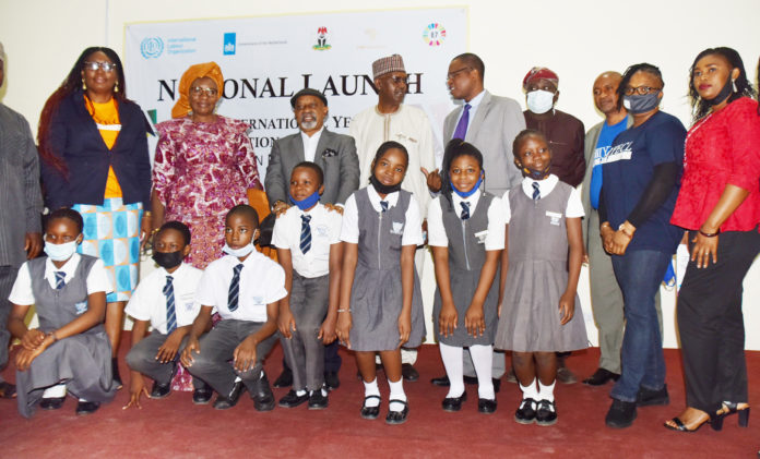The Honourable Minister of Labour and Employment, Dr Chris Ngige (3rd left); Minister for Women Affairs, Dame Pauline Tallen (2nd left); Representatives of Minister for Federal Capital Territory, and ILO Chi Chi Anunu; Permanent Secretary, Federal Ministry of Labour and Employment, Dr Yerima Peter Tarfa with other dignitaries and Pupils of Tithemi International School, Lugbe during the launching of the 2021 International Year for the Elimination of Child Labour (IYECL)