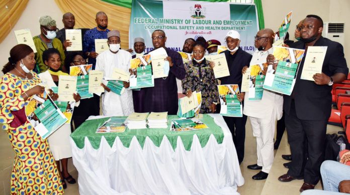The Honourable Minister of State, Federal Ministry of Labour and Employment, Festus Keyamo SAN (5th left); Permanent Secretary, Federal Ministry of Labour and Employment, Dr Yerima Peter Tarfa (4th left); Director, Occupational Safety and Health, Mrs Loretta Adogu (3rd left); NECA Representative, Nike Ajala (left) and other dignitaries during the Launching of the Revised National Policy on Occupational Safety and Health and Commemoration of 2021 World Day for Safety and Health at Work in Abuja The Honourable Minister of State, Federal Ministry of Labour and Employment, Festus Keyamo SAN (5th left); Permanent Secretary, Federal Ministry of Labour and Employment, Dr Yerima Peter Tarfa (4th left); Director, Occupational Safety and Health, Mrs Loretta Adogu (3rd left); NECA Representative, Nike Ajala (left) and other dignitaries during the Launching of the Revised National Policy on Occupational Safety and Health and Commemoration of 2021 World Day for Safety and Health at Work in Abuja