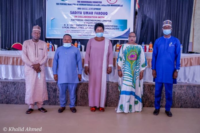 IMG-20210422-WA0000 (2nd Right) The Representative of the Honourable Minister of Humanitarian Affairs, Disaster Management and Social Development, Sadiya Umar Farouq, Director Special Needs, Mrs Florence Nkechi Onwukwe, (1st Left) the Representative of the Permanent Secretary of the Ministry, Chief Community Development Officer, Garba Magaji, (Middle) the Representative of the Honourable Commissioner Women Affairs, Benue State, Eunice Tachia Terumbur, (1st Right) the Representative Resource Person, Kolawole Taiwo, (2nd Left) the Representative Consultant Factorial Engineer Limited Workshop, Charles Ofonimeh, during the Opening ceremony of the 3-Day Capacity Building to Identify Local Producers of Assistive Technologies. On the 21st April, 2021, in Markurdi, Benue State. Photo: Khalid Ahmed.