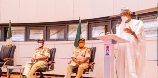 Minister of Interior, Ogbeni Rauf Aregbesola (Right) addressing Passport Control Officers at NIS Hdqrs on Thursday as the CG NIS, Mohammad Babandede (Left) and DCG Immigration, A.B. Yarima (Middle) watched.