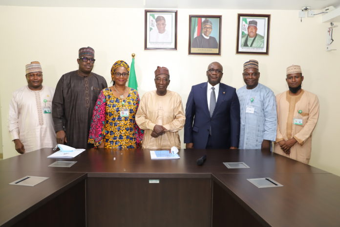 (2ND L-R), The Minister of State, Agriculture and Rural Development ,Hon. Mustapha Baba Shehuri ,Prof. Olufumilayo Para- Mallam ,Minister of Agriculture and Rural Development ,Alhaji Muhammad Sabo Nanono and Permanent Secretary in the Ministry,Dr. Ernest Umakhihe, in a group photograph after the Meeting (2ND L-R), The Minister of State, Agriculture and Rural Development ,Hon. Mustapha Baba Shehuri ,Prof. Olufumilayo Para- Mallam ,Minister of Agriculture and Rural Development ,Alhaji Muhammad Sabo Nanono and Permanent Secretary in the Ministry,Dr. Ernest Umakhihe, in a group photograph after the Meeting