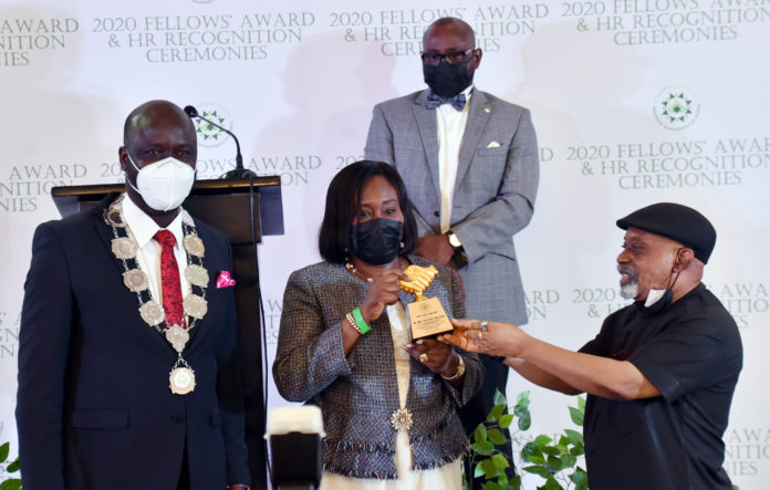DSC_7298 R-L the Honourable Minister of Labour and Employment, Dr Chris Ngige, presenting the Icon of Human Resources Award to Dr Folasade Yemi Esan, Head of Service of the Federation, while the President of CIPMN, Wale Adeniran stand by during the 2020 Fellow’s Award and the Human Resources (HR) Recognition Ceremonies of the Chartered Institute of Personnel Management of Nigeria (CIPMN) in Abuja