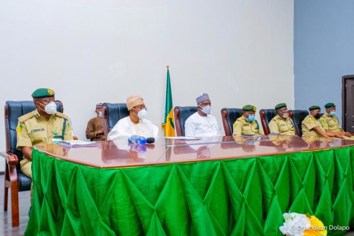 Minister of Interior, Ogbeni Rauf Aregbesola (2nd Left), Perm. Sec. Min. of Interior, Dr. Shuaib Belgore (3rd Left), Ag. CG of NCoS, John Mrabore (1st Left) and others during the HMI's Meeting with Squadron Commanders of NCoS in Abuja on Friday. Minister of Interior, Ogbeni Rauf Aregbesola (2nd Left), Perm. Sec. Min. of Interior, Dr. Shuaib Belgore (3rd Left), Ag. CG of NCoS, John Mrabore (1st Left) and others during the HMI's Meeting with Squadron Commanders of NCoS in Abuja on Friday.