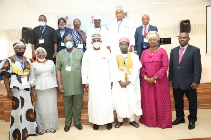Dr. Shuaib Belgore Perm. Sec./ Principal Regr. of Marriages in Nigeria (Middle) flanked by Apostle Biodun Sanyaolu/ Rep. of CAN President (left), Dr. Mohammad Adams, Chief Imam of Abuja (right), Barr. M. Soyinka- Onijala (2nd right) and other dignitaries in a group photograph after the opening ceremony of the Stakeholders Conference on the Administration of Statutory Marriage in Nigeria, held in Abuja, today.