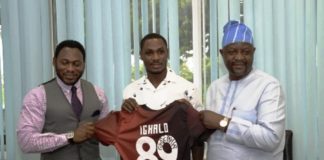 R-L: Hon. Minister of Youth and Sports Devlpt. Mr. Sunday Dare; holding Manchester United Jersey bearing IGHALO No. 89: with Odion Ighalo (Middle); and Daniel Amokachie, S.A. Sports to Mr. President.