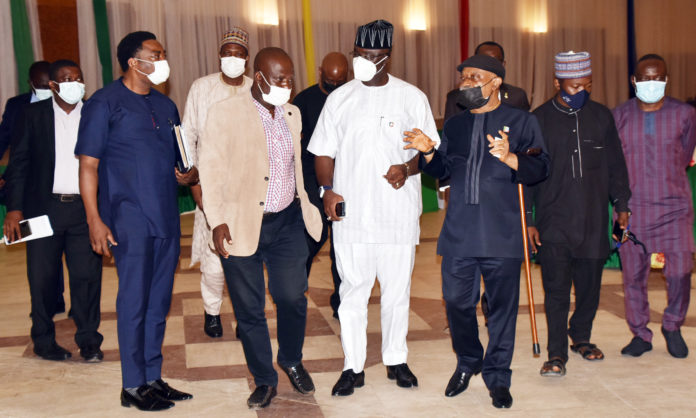 Honourable Minister of Labour and Employment, Dr Chris Ngige (3rd right) Minister of State, Budget and National Planning, prince Clement Agba (3rd left) after the meeting of the leadership of NMA, NARD and JOHESU with the Federal Government on the Health workers allowance in Abuja.