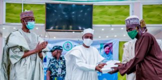 (Left) The Representative of the Honourable Minster of Humanitarian Affairs, Disaster Management and Social Development,Sadiya Umar Farouq, the Permanent Secretary of the Ministry, Bashir Nura Alkali, (middle) The Representative of the Government of Kano State, SSG Usman Waziru Gaya, (Right) an Independent Monitor, during the distribution of engagement letters and monitoring devices to Independent Monitors in Kano State, on the 15th June, 2021. In Kano.