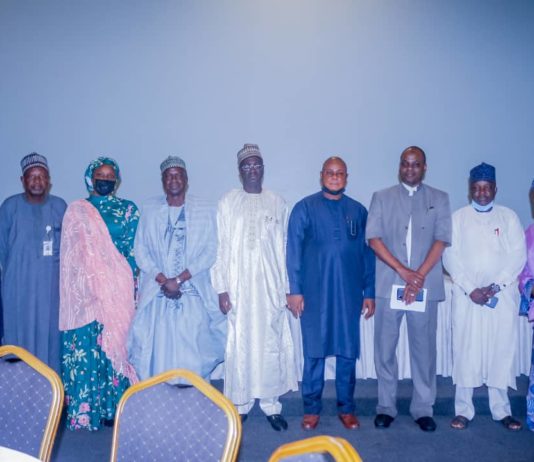 (5th Right) The Representative of the Permanent Secretary, Federal Ministry of Humanitarian Affairs, Disaster Management and Social Development,Bashir Nura Alkali, Director Humanitarian Affairs, Grema Ali Alhaji, (6th Right) National Coordinator for NSIP, Engr Umar B. Bindir, (4th Right) Direct,or PRS, Repheal Obi, (2nd Left) TA NGO, Laiseing NEMA, Musa Bungudu, (1st Left) DFA NSIP, Adaramoye Joseph Oluwole, (3rd Left) TA to the Minster on Home-Grown, Aisha Digil, during the Agenda for the Orientation for the FMHADMSD Staff Monitoring the Enumuration Exercise for the Beneficiary of the NHGSFP, on 22nd June, 2021. In Abuja.