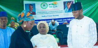 (middle) Representative of the Honourable Minister of Humanitarian Affairs, Disaster Management and Social Development, Sadiya Umar Farouq, the Deputy Director, Planning, Research and Statistics of the Ministry, Safiya Sani, (Right) Kogi State Focal Person on NSIP, Abdulkareem Suleiman, presenting engagement letter and tablet to (left) trained Independent Monitor, Mummy Rekiya Mohammed, during the flag off ceremony of the distribution of engagement letters and tablets to trained Independent Monitors in Kogi State, Wednesday June 30th, 2021