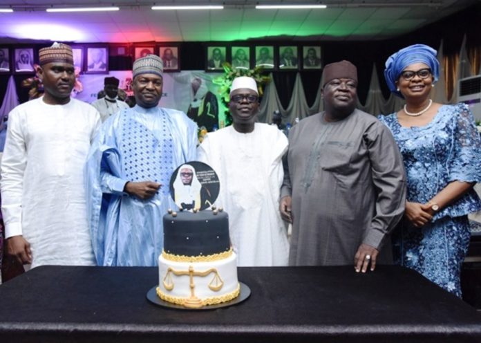 HONOUR OF APATA’S 60 YEARS BIRTHDAY ANNIVERSAY THE HONOURABLE ATTORNEY GENERAL OF THE FEDERATION OF JUSTICE, ABUBAKAR MALAMI, SAN, RETIRED SGF, DAYO APATA, SAN, ACTING SGF/PS, MR. UMAR MOHAMMED, JUSTICE STELLA ANUKAM, PRESIDENT, AFRICAN COURT ON PEOPLE& HUMAN RIGHTS, MOHAMMED BABADOKO, NEWLY APPOINTED DIRECTOR, PUBLIC PROSECUTION IN A GROUP PHOTOGRAPH CUTTING THE CAKE IN HONOUR OF APATA’S 60 YEARS BIRTHDAY ANNIVERSAY