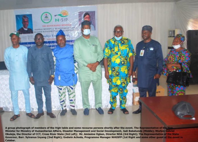 Fourth left: Representative of the Honourable Minister of Humanitarian Affairs, Disaster Management and Social Development, Babatunde Jaji, Second left, Representative of the State Focal Person, Barrister Silvanus Iyang, First right, Conditional Cash TransferChairperson, Godwin Achoda, Third right NHGSFP Chairperson Gabriel Okulaja, Third left NOA Assime Usetu Ogban and others during the IMs Flag Off and Distribution of Engagement Letters and Tablets in Ministry of Finance Government, Hall Calabar, Cross River State July 3, 2021.