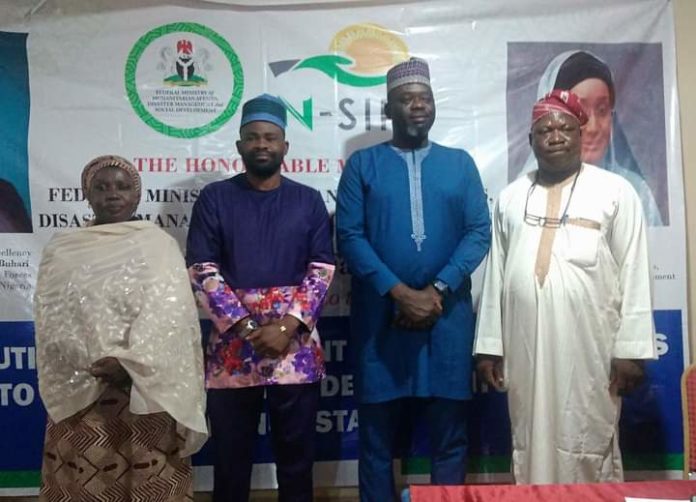 IMG-20210711-WA0011 (2nd Right) The Representative of the Honourable Minister of Humanitarian Affairs, Disaster Management and Social Development, Sadiya Umar Farouq, National Coordinator NASSCO, Iorwa Apera, (2nd Left) Benue State Focal Person, Terri Damsa, (1st Left) DD PRS, Safiya Sani, during the Distribution of Engagement letters and Monitoring devices to Independent Monitors in Benue State, on 10th July, 2021. In Markurdi.