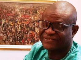 President Buhari greets IPI Secretary, Raheem Adedoyin at 60