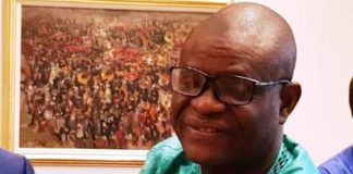 President Buhari greets IPI Secretary, Raheem Adedoyin at 60
