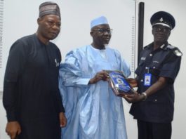 L-R: Director-General, National Institute of Police Studies, Prof. Olu Ogunsakin, Minister of Police Affairs, Muhammad Maigari Dingyadi and AIG Gabriel. N. Tommy (Sierra Leon) during the presentation of plague by course participants of the Strategic Leadership and Command Course 3/2021 at the National Institute of Police Studies in Abuja.