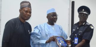 L-R: Director-General, National Institute of Police Studies, Prof. Olu Ogunsakin, Minister of Police Affairs, Muhammad Maigari Dingyadi and AIG Gabriel. N. Tommy (Sierra Leon) during the presentation of plague by course participants of the Strategic Leadership and Command Course 3/2021 at the National Institute of Police Studies in Abuja.