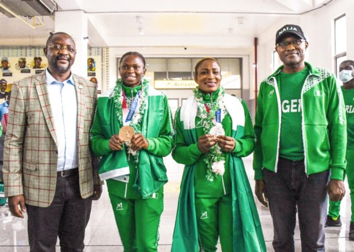 FG commends Athletes on galant performance at 2020 Tokyo Games L-R: Hon. Minister, Fed. Ministry of Youth & Sports Devlpt. Mr. Sunday Dare (Led Team Nigeria Contingent Arrival); ESE Brume (Olympian-Bronze Medalist Long Jump); Blessing Oborududu (Olympian-Silver Medalist Wrestling); Mr. Nebeolisa Anako, Permanent Secretary(FMYSD) @ the Nnamdi Azikiwe Int'l Airport, Abuja-August 7, 2021
