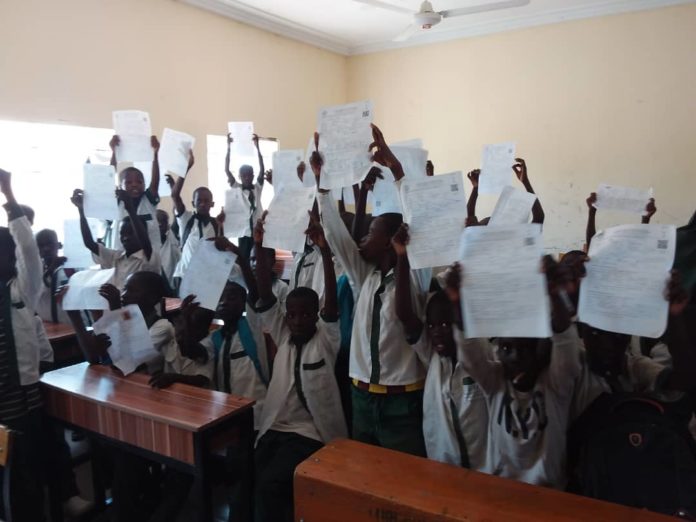 IMG-20210807-WA0002 Pupils displaying their from as they want to be captured in Popmmari Pry Sch, 1000 Housing Estate, Konduga LGA, Borno State.