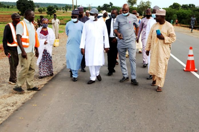 The Honourable Minister of State for Works and Housing, Engr. Abubakar D. Aliyu FNSE and his team during an inspection tour of Sokoto-Tambuwa-Gwandu-Aliero-Jega-Yawuri-Kotongora Road, (Pictures show On-going Lane Marking at the Kebbi Section of the Road)