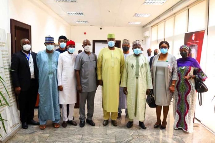 SGF, Boss Mustapha (4th R), EVC NASENI, Prof.M.S. Haruna (3rd R), PS, PEAO (OSGF), Andrew Adejo and other officials from NIRSAL & MECA during the courtesy visit to SGF