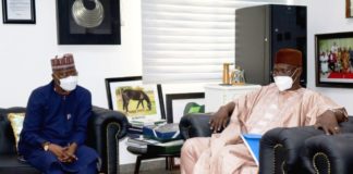 SGF, Boss Mustapha (L) conversing with Gov. Abdullahi Sule