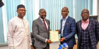 The Event of Signing of MoU between the Federal Ministry of Youth & Sports Devlpt. and the KONGA Group; inside the office of the Hon. Minister @ the Moshood Abiola National Stadium, Abuja. Holding the signed MoU is the Hon. Minister, Mr Sunday Dare ( in Grey Suit); with Mr. Leo Stan Eke, President of KONGA Group ( in a Blue Blazer Jacket) ; Supporting the Hon. Minister is the Permanent Secretary of the Ministry, Mr Nebeolisa Anako; extreme right is KONGA Official.