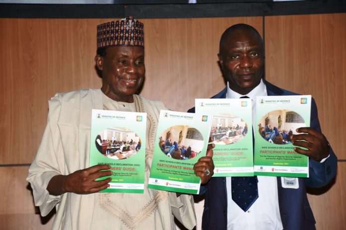 Minister of Defence, Maj Gen Bashir Salihi Magashi (L) and the Permanent Secretary, Musa Istifanus (R) with the SSD manual Minister of Defence, Maj Gen Bashir Salihi Magashi (L) and the Permanent Secretary, Musa Istifanus (R) with the SSD manual