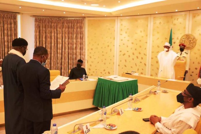 President Buhari swears in two INEC Commissioners