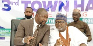 Hon Minister of Youth & Sports Devlpt. Mr Sunday Dare in a banter with the Permanent Secretary, Alhaji Ismail Abubakar during the TownHall meeting