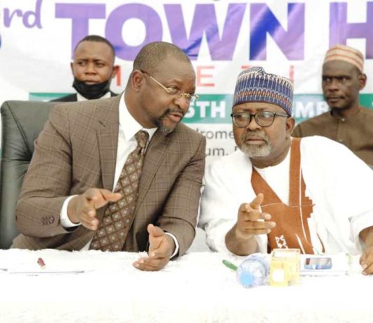 Hon Minister of Youth & Sports Devlpt. Mr Sunday Dare in a banter with the Permanent Secretary, Alhaji Ismail Abubakar during the TownHall meeting