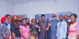 (4th Right) The Permanent Secretary,Federal Ministry of Humanitarian Affairs,Disaster Management and Social Development, Bashir Nura Alkali, (3rd Right) Director HRM Abdulrahman Babatunde Jaji, (2nd Right) SM Team Humanitarian Affairs, Kazim Adenekan, and Team members of the Ministry's Women Handball, during the Team's visit to the office of the Permanent Secretary to hand over the 1st Inter Ministerial Handball Competition, 1st position Trophy. On the 10th November, 2021. In Abuja.