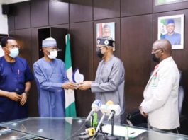 (1st left) Dr. Jerome Mafeni, TA (NHED) (2nd lfet) Dr. Emmanuel Sokpo, Country Director (NHED), HMSH Dr. Olorunnimbe Mamora with PSH Mr. Mahmuda Mamman during the presentation of Award