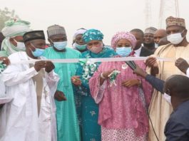 R-L Deputy Governor of Bauchi state, Senator Baba -Tela, Hon. Minister of state for Industry, Trade and Investment, Amb. Maryam y .Katagum cutting the tape, Hajiya Kulu Abba Kyari, Director, Soil Erosion and Flood Control Dept, Mr. Mathias Eluma (EPO), the chairman of Jama'are LGA, Hon., Samaila Yusuf Jarma, along with other dignitaries at the event.