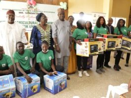 L-R, District Head of Gwafan, Danladi Kaze, Rep by Adagwom Izere Chiefdom, Jos north; Ada Emmanuel Ajik, Zonal Coord, Fed. Ministry of Youth & Sports Devpt (North Central), Mrs. Deborah Pitman, Rep of the Minister of Youth and Sports Devpt, Mr Sunday Dare and Director, Enterprise Devpt and Promotion Dept, Olugbenga Momoh, Perm Sec, Plateau State Ministry of Youth & Sports Devpt, Mrs. Helen Ishaya and some participants with their starter packs at the end of the 2-week Nat. Youth in Agriculture Empowerment Training Programme organised by the Ministry for youth in the 36 States including Abuja at Jos, Plateau State over the weekend
