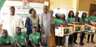 L-R, District Head of Gwafan, Danladi Kaze, Rep by Adagwom Izere Chiefdom, Jos north; Ada Emmanuel Ajik, Zonal Coord, Fed. Ministry of Youth & Sports Devpt (North Central), Mrs. Deborah Pitman, Rep of the Minister of Youth and Sports Devpt, Mr Sunday Dare and Director, Enterprise Devpt and Promotion Dept, Olugbenga Momoh, Perm Sec, Plateau State Ministry of Youth & Sports Devpt, Mrs. Helen Ishaya and some participants with their starter packs at the end of the 2-week Nat. Youth in Agriculture Empowerment Training Programme organised by the Ministry for youth in the 36 States including Abuja at Jos, Plateau State over the weekend