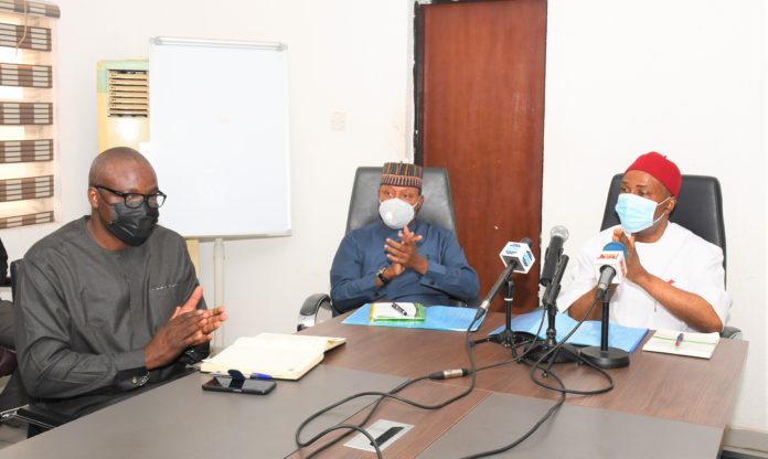 Hon. Minister of Science, Technology and Innovation Dr. Ogbonnaya Onu (right), Hon. Minister of State for Science, Technology and Innovation Barr. Mohammed H. Abdullahi (middle), Overseeing Permanent Secretary Federal Ministry of Science, Technology and Innovation Mr. Idowu Afe (left), during the Presentation of the Site Plan of the 6th STI Expo by the Coordinator Niphemy Solutions/Mirakon Events to the Hon. Ministers Office in Abuja