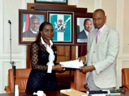FORMER ACTING SGF/PS, BENJAMIN OKOLO HANDING OVER TO THE NEWLY APPOINTED SGF/PS, MRS. BEATRICE EJODAMEN JEDY-AGBA, AT THE HAGF’S CONFERENCE ROOM, FEDERAL MINISTRY OF JUSTICE ABUJA, ON THURSDAY 28TH APRIL, 2022