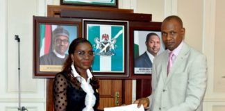 FORMER ACTING SGF/PS, BENJAMIN OKOLO HANDING OVER TO THE NEWLY APPOINTED SGF/PS, MRS. BEATRICE EJODAMEN JEDY-AGBA, AT THE HAGF’S CONFERENCE ROOM, FEDERAL MINISTRY OF JUSTICE ABUJA, ON THURSDAY 28TH APRIL, 2022