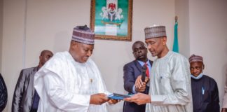 (Right) The Outgoing Permanent Secretary, Federal Ministry of Humanitarian Affairs, Disaster Management and Social Development, Bashir Nura Alkali, (Left) The Incoming Permanent Secretary of the Ministry, Nasir Sani Gwarzo, during the Hand/Take- Over Ceremony of the office of the Permanent Secretary, held in the Ministry, on Monday, 11th April, 2022.
