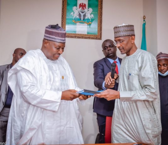 (Right) The Outgoing Permanent Secretary, Federal Ministry of Humanitarian Affairs, Disaster Management and Social Development, Bashir Nura Alkali, (Left) The Incoming Permanent Secretary of the Ministry, Nasir Sani Gwarzo, during the Hand/Take- Over Ceremony of the office of the Permanent Secretary, held in the Ministry, on Monday, 11th April, 2022.