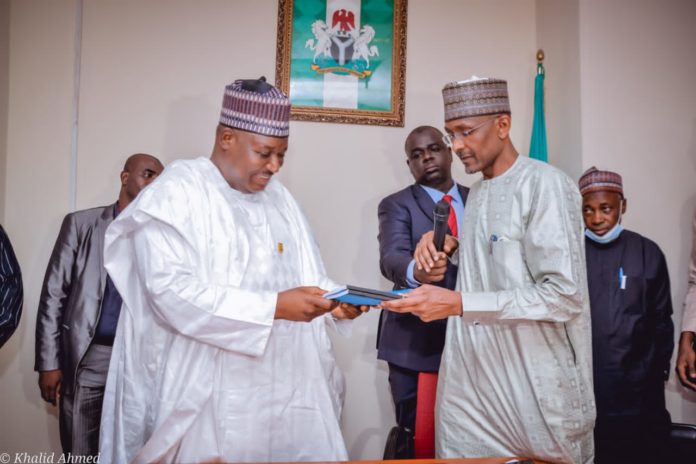 IMG-20220411-WA0001 (Right) The Outgoing Permanent Secretary, Federal Ministry of Humanitarian Affairs, Disaster Management and Social Development, Bashir Nura Alkali, (Left) The Incoming Permanent Secretary of the Ministry, Nasir Sani Gwarzo, during the Hand/Take- Over Ceremony of the office of the Permanent Secretary, held in the Ministry, on Monday, 11th April, 2022.