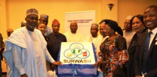 The Honourable Minister of Water Resources Engr Suleiman Adamu flanked by his counterpart in the Ministry of Women Affairs Mrs Pauline Tallen as well as the Permanent Secretary FMWR Mrs Didi Walson-Jack mni and others at the unveiling of the SURWASH Logo