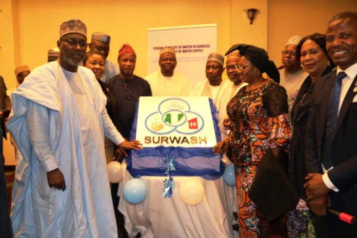 The Honourable Minister of Water Resources Engr Suleiman Adamu flanked by his counterpart in the Ministry of Women Affairs Mrs Pauline Tallen The Honourable Minister of Water Resources Engr Suleiman Adamu flanked by his counterpart in the Ministry of Women Affairs Mrs Pauline Tallen as well as the Permanent Secretary FMWR Mrs Didi Walson-Jack mni and others at the unveiling of the SURWASH Logo