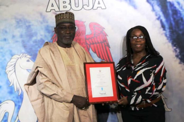 The Honourable Minister of Water Resources Engr Suleiman H Adamu FNSE FAeng being presented the award by the Nigeria Country Director, WaterAid, Mrs Evelyn Mere The Honourable Minister of Water Resources Engr Suleiman H Adamu FNSE FAeng being presented the award by the Nigeria Country Director, WaterAid, Mrs Evelyn Mere